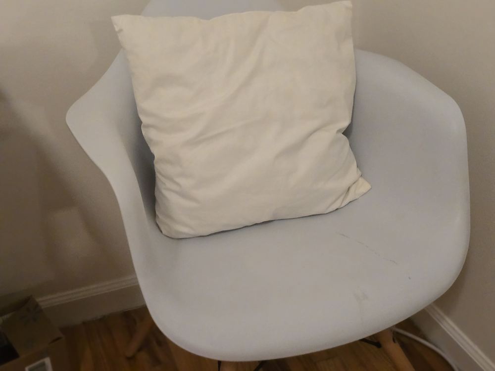 A soft pillow on a chair in the Kids Suite