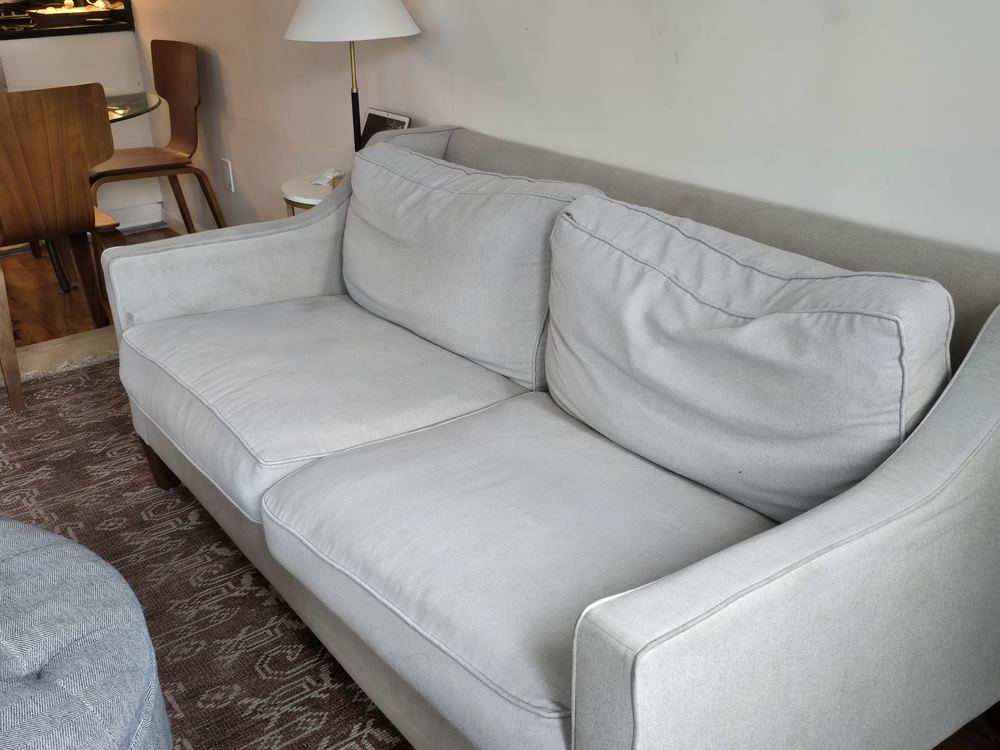 The plush lounge sofa in the lobby seating area